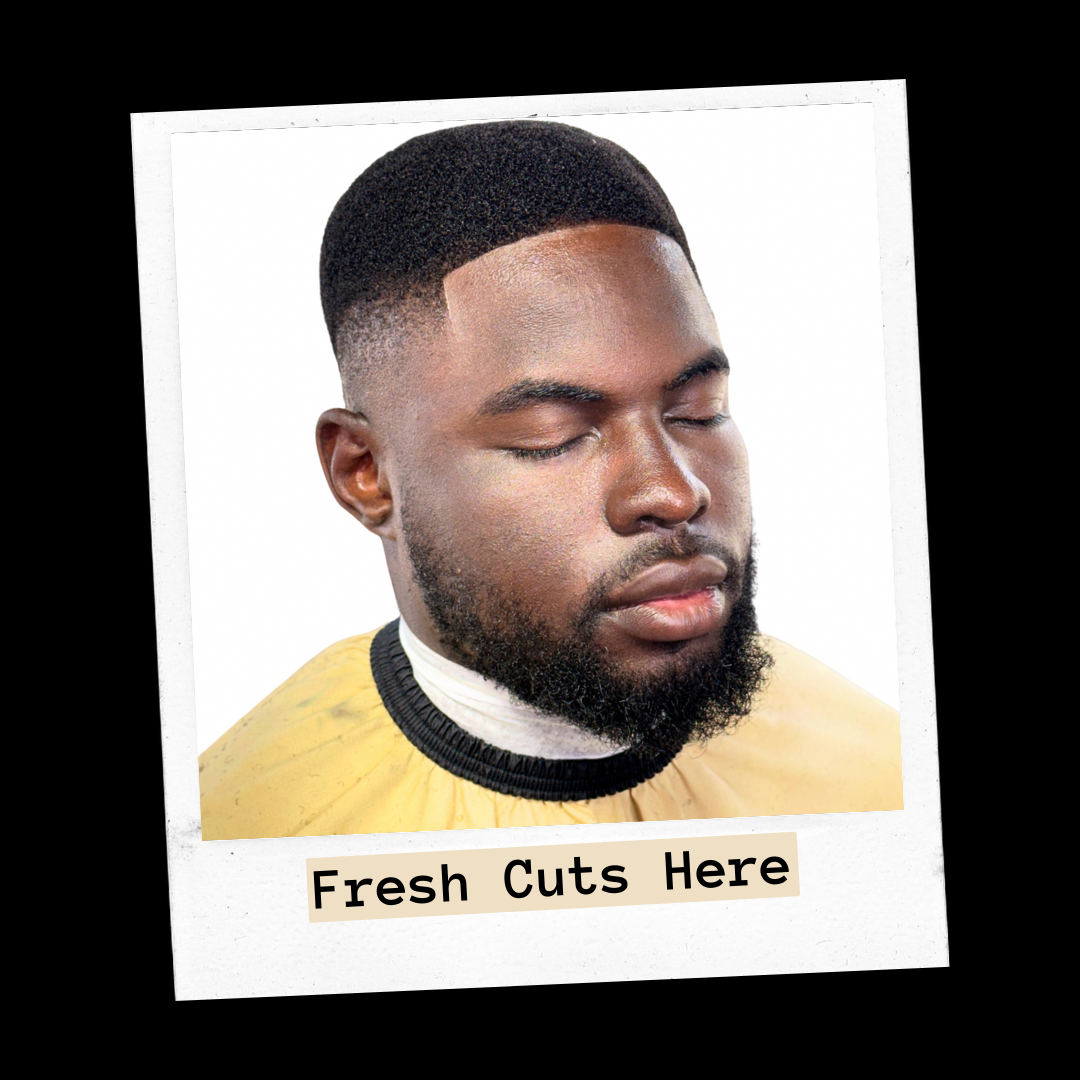Client side view of a bearded man with a close fade and sharp line-up