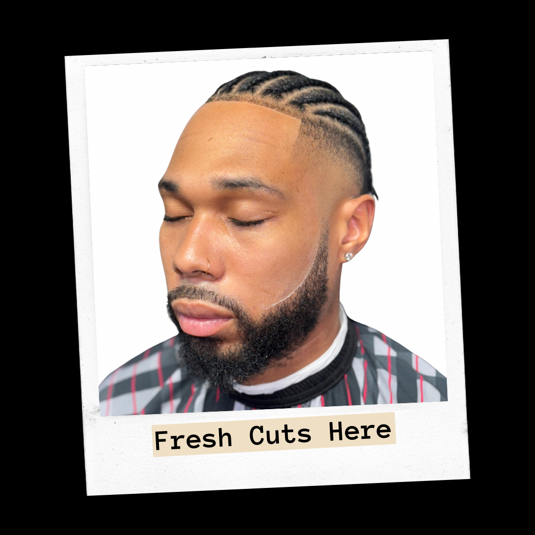 Client with cornrows, a faded side and a shaped beard