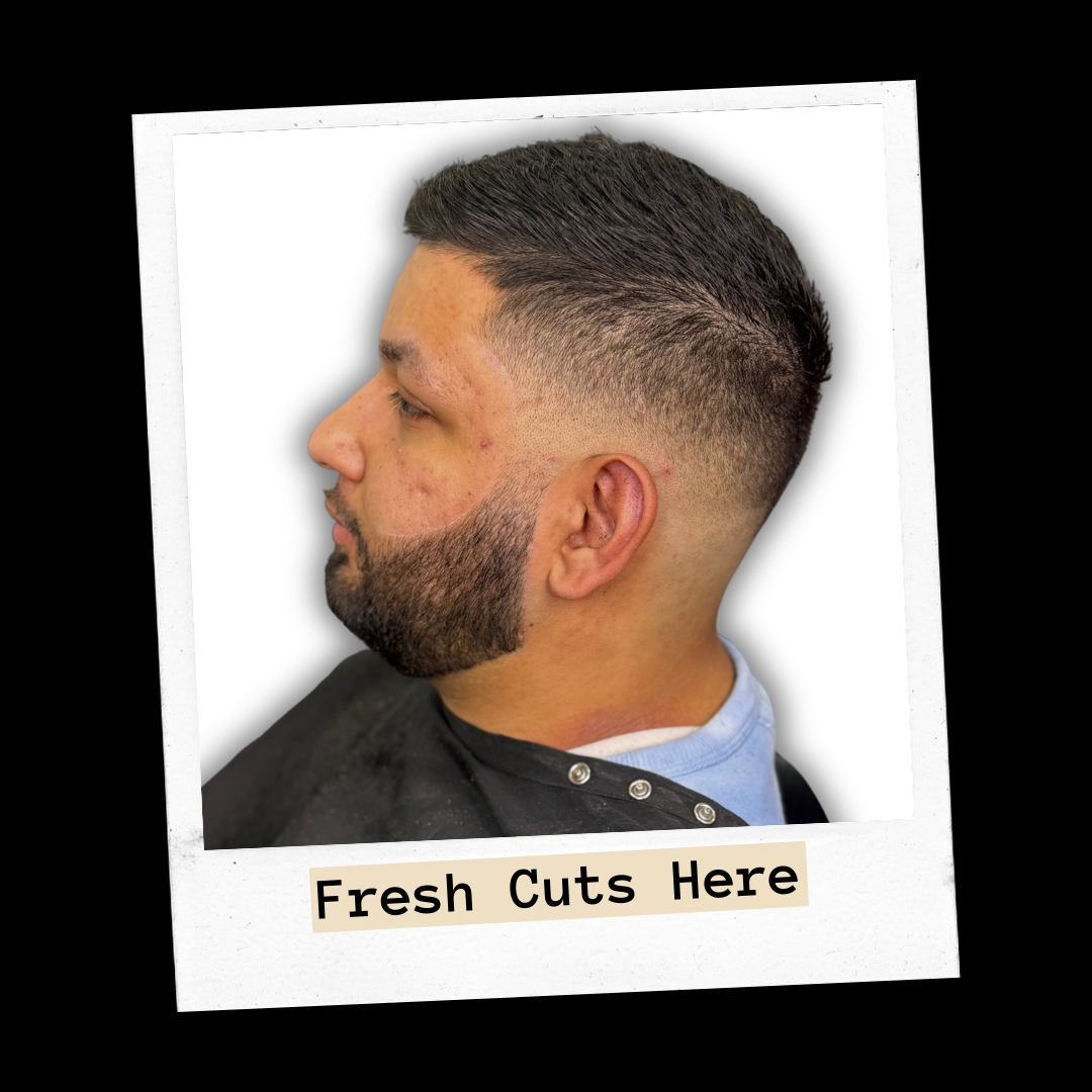 Client side profile of a short fade with a shaped beard