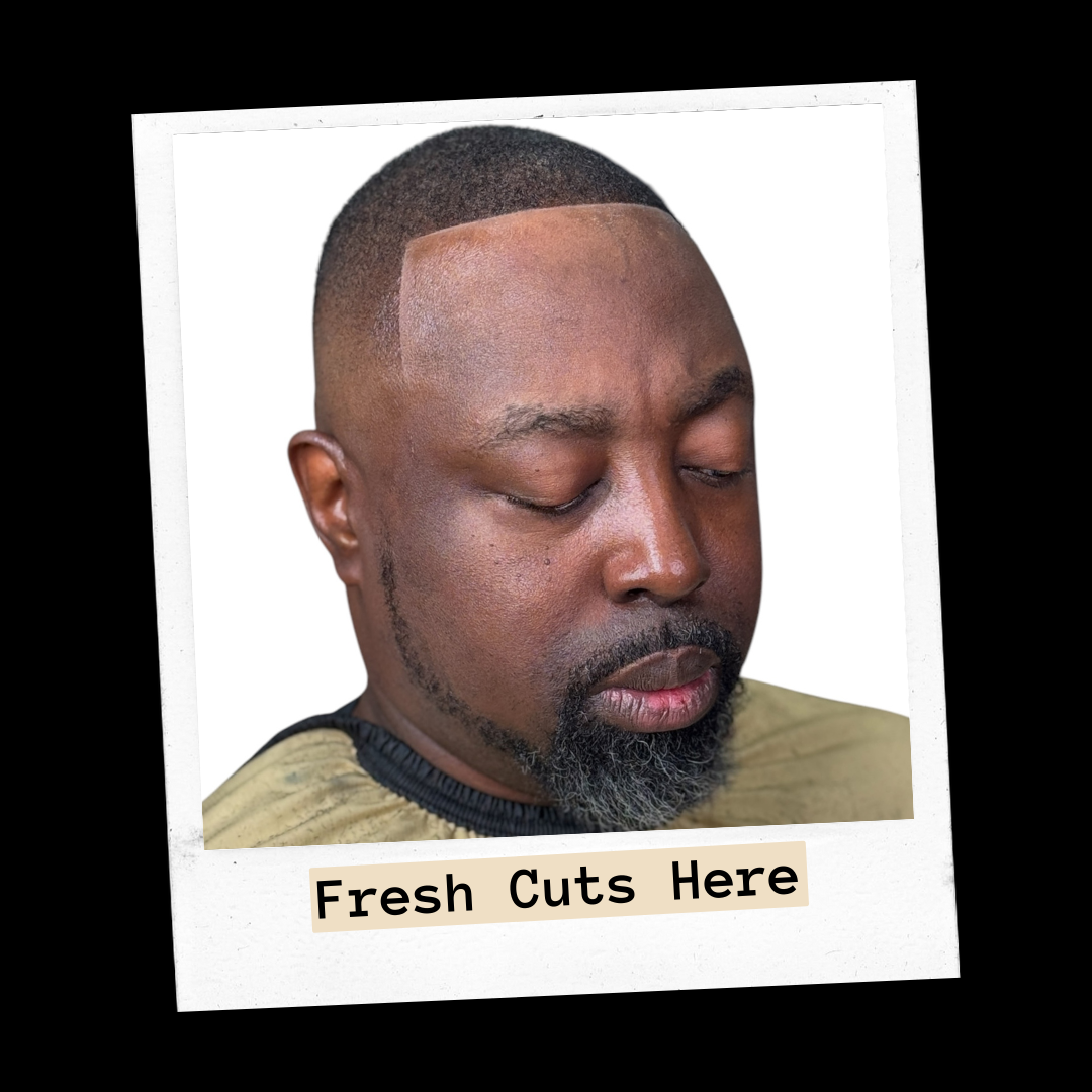 Client with a close crop and sharp line-up, eyes closed